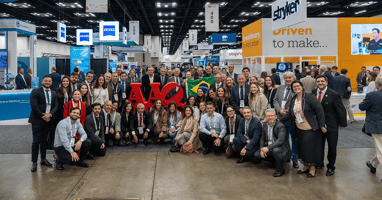 Group photo of Brazilian otolaryngologists in expo hall